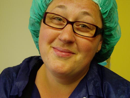 Mum in glasses and a surgical green cap